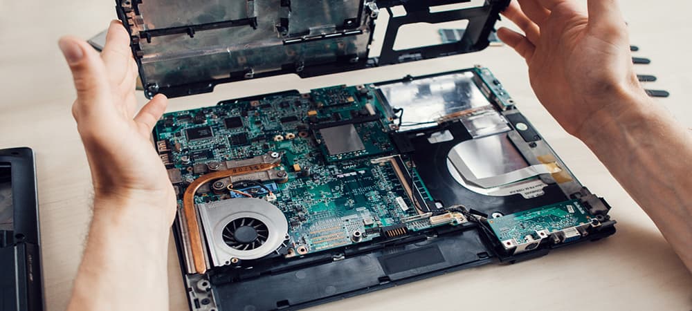 Laptop disassembling in repair shop, close-up